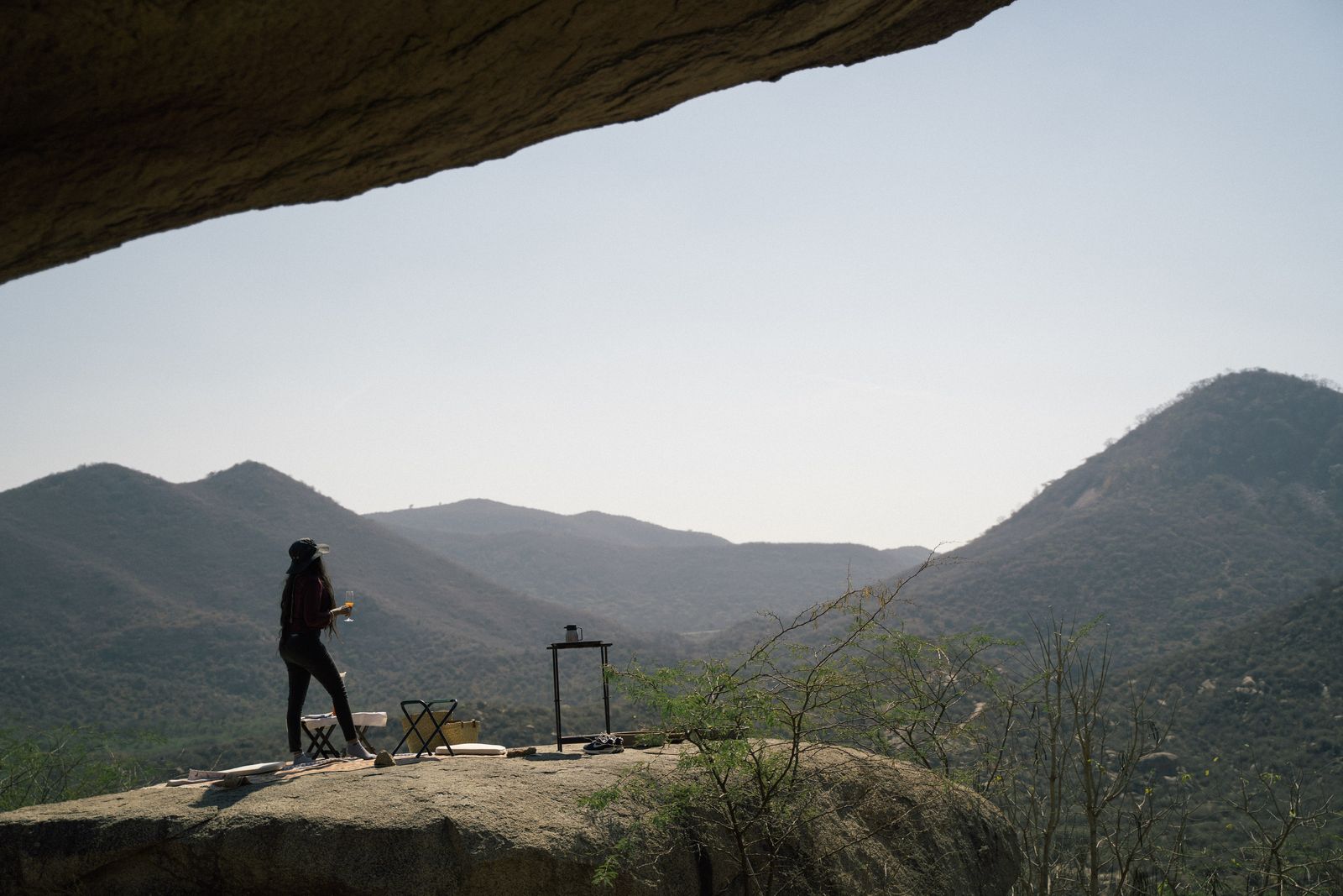 Plan A crew filming on a mountain ledge at dusk