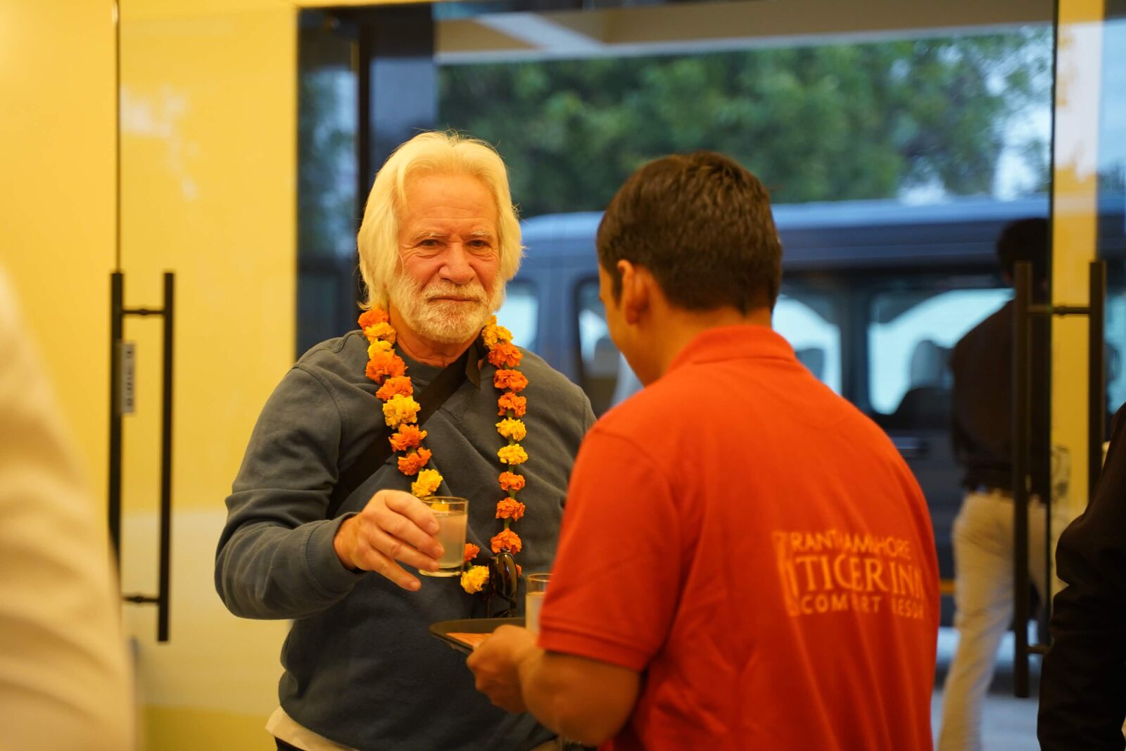 Guest receiving a welcome drink at the resort
