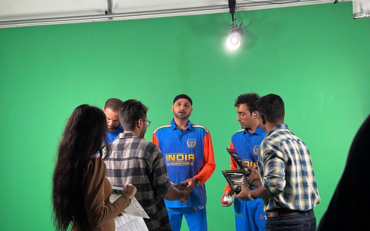 Cast and crew preparing a green-screen production