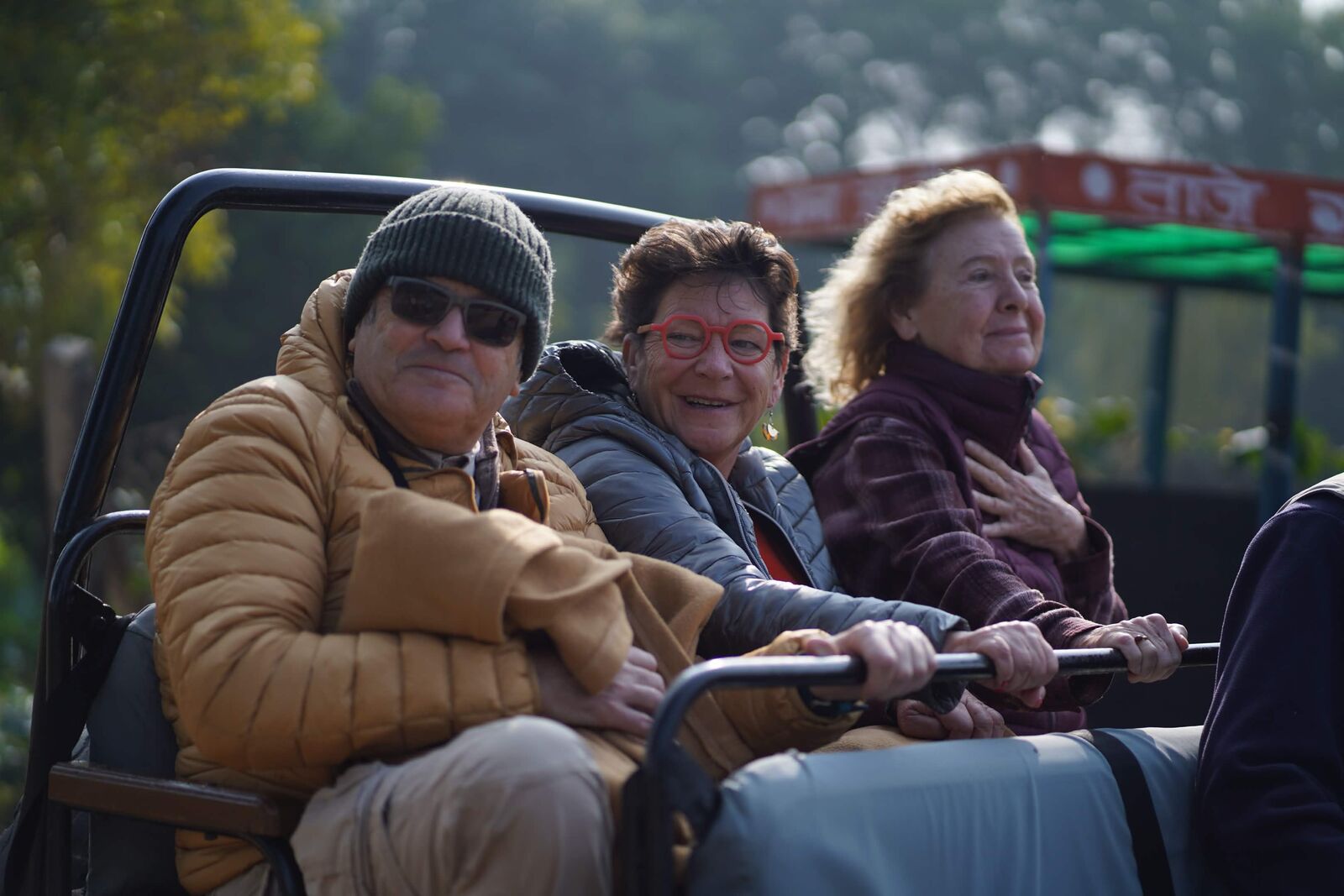 Guests riding in an open safari vehicle